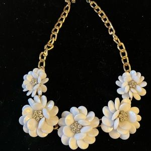 18” white lucite flowers with clear rhinestone center.